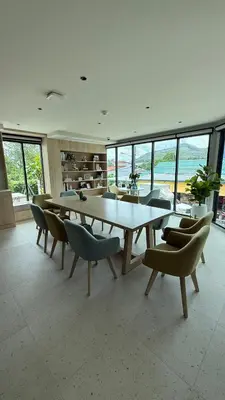 a dining room with a large table and chairs at Space Cherngtalay Condo in bangtao by sahana in Bang Tao Beach