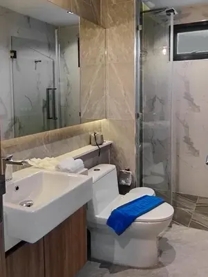 a bathroom with a toilet and a sink and a shower at Holiday Villa M9 with Private Pool, 300m Rawai beach in Phuket Town