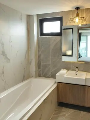 a bathroom with a tub and a sink and a mirror at Tropical villa Sweet Dreams R20, Private Pool, Rawai Beach in Phuket Town