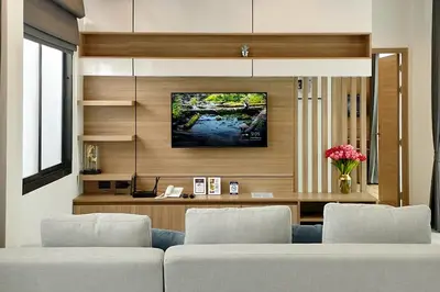 a living room with a couch and a tv at Tropical villa Sweet Dreams R20, Private Pool, Rawai Beach in Phuket Town
