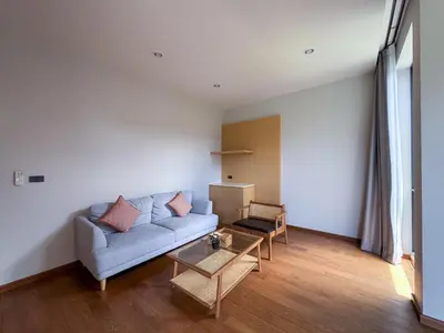 a living room with a couch and a table at Luxury 3-Bedroom Pool Villa Long One B9 with Panoramic Chalong Bay View in Ban Bo Rae