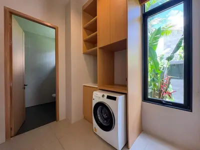 a washer and dryer in a room with a window at Luxury 3-Bedroom Pool Villa Long One B9 with Panoramic Chalong Bay View in Ban Bo Rae