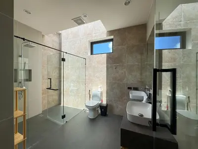 a bathroom with a toilet and a sink and a shower at Luxury 3-Bedroom Pool Villa Long One B9 with Panoramic Chalong Bay View in Ban Bo Rae