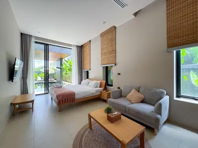 a living room with a bed and a couch at Luxury 3-Bedroom Pool Villa Long One B9 with Panoramic Chalong Bay View in Ban Bo Rae