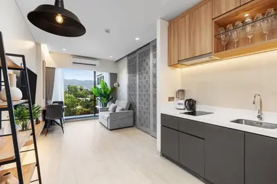 a kitchen with a sink and a counter at Laguna Lakeside BangTao Phuket in Bang Tao Beach