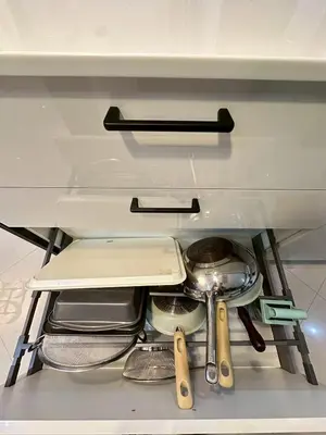 a drawer in a refrigerator filled with kitchen utensils at The White House Kamala II in Kamala Beach