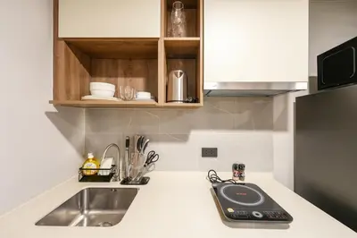 a kitchen with a sink and a counter top at New condo near the sea, Laguna, Choeng Thale 324 in Ban Thalat Choeng Thale