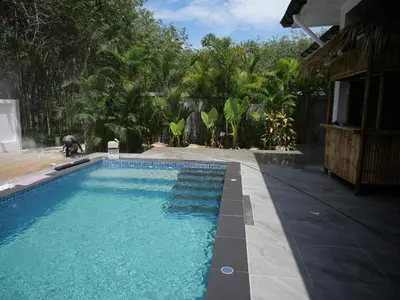 a swimming pool in front of a house at NEW! Welcome ! Villa - 3 bedroom 3 Baths - Ao Nang area in Ban Khao Klom
