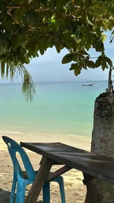 a wooden bench sitting on the beach next to a tree at NEW! Welcome ! Villa - 3 bedroom 3 Baths - Ao Nang area in Ban Khao Klom