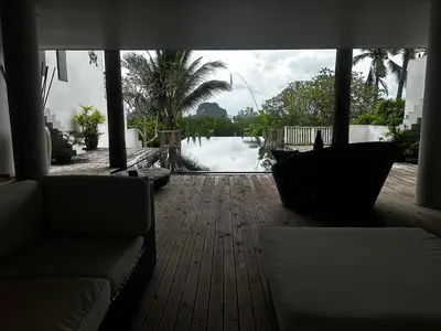 a living room with a view of a swimming pool at NEW! Welcome ! Villa - 3 bedroom 3 Baths - Ao Nang area in Ban Khao Klom