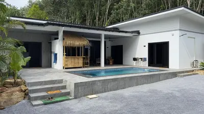 a house with a swimming pool in front of it at NEW! Welcome ! Villa - 3 bedroom 3 Baths - Ao Nang area in Ban Khao Klom