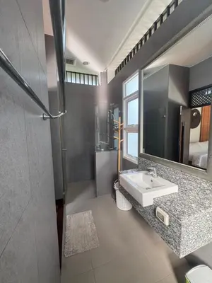 a bathroom with a sink and a mirror at Luxury Phuket Pool Villa in Ban Saiyuan (1)