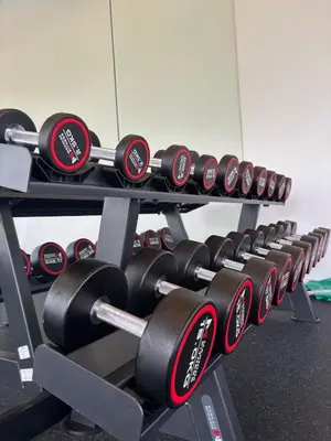 a row of dumbbells in a gym at Lili House Phuket in Ban Na Nai