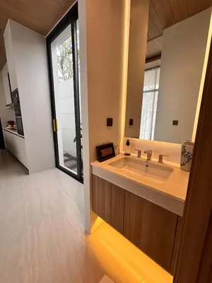 a bathroom with a large sink and a large window at Lili House Phuket in Ban Na Nai