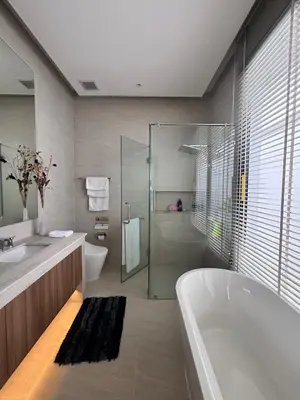 a bathroom with a tub and a sink and a shower at Lili House Phuket in Ban Na Nai