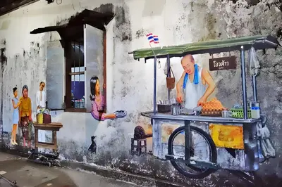a painting of a food cart on the side of a building at XX GO INN Phuket Old Town โก อินน์ ภูเก็ต ย่านเมืองเก่า in Phuket Town