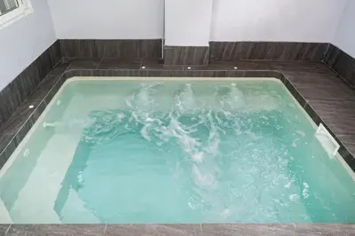 a jacuzzi tub with green water in it at 3BR pool at Bangla Patong reach beach in 5m walk in Patong Beach
