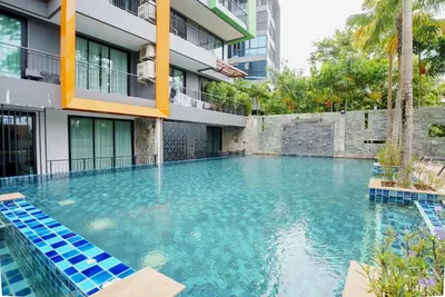 a swimming pool in the middle of a building at 405 Relife 5 Minutes Walk To Nai Harn Beach in Rawai Beach