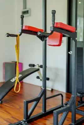a gym with two tread machines with a yellow ribbon at 405 Relife 5 Minutes Walk To Nai Harn Beach in Rawai Beach