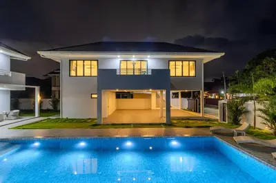 a house with a swimming pool at night at 4BR Big Pool 2 Villas Same Land Near Nai Harn V258 in Rawai Beach