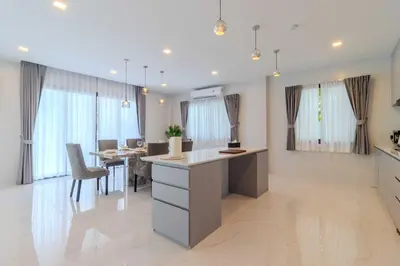 a kitchen and dining room with a table and chairs at 4BR Big Pool 2 Villas Same Land Near Nai Harn V258 in Rawai Beach