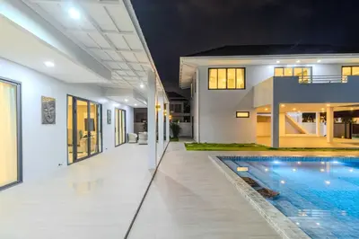 a swimming pool in the middle of a house at 4BR Big Pool 2 Villas Same Land Near Nai Harn V258 in Rawai Beach