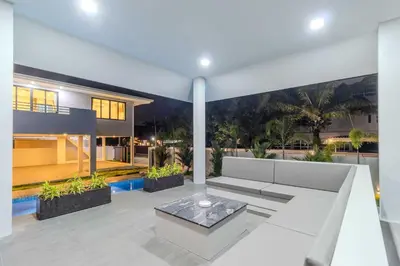 a living room of a house with a white couch at 4BR Big Pool 2 Villas Same Land Near Nai Harn V258 in Rawai Beach