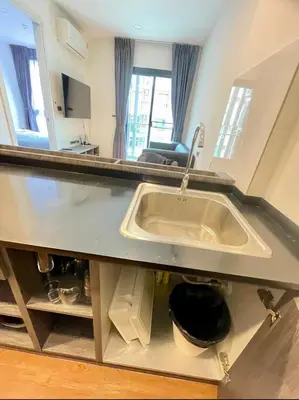 a kitchen counter with a sink in a room at The Central Escape Phuket in Ban Rangeng