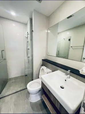 a bathroom with a toilet and a sink and a shower at The Central Escape Phuket in Ban Rangeng