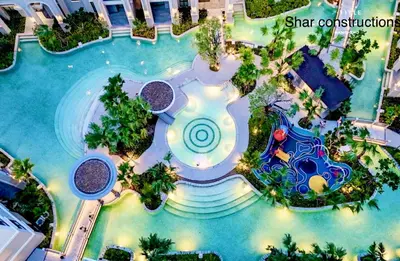 an overhead view of a swimming pool at a resort at The title Legendary in Bang Tao Beach