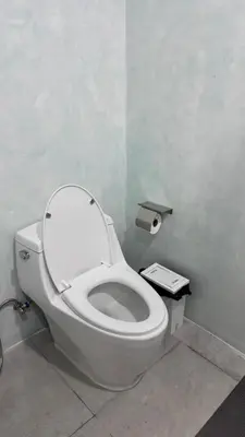 a bathroom with a white toilet in a room at Bang Jo Garden Home in Koh Lone