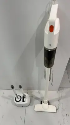 a hair dryer and two toothbrushes in a room at Bang Jo Garden Home in Koh Lone