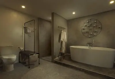 a bathroom with a tub and a toilet and a sink at Baan Chang Sanctuary in Laguna Phuket