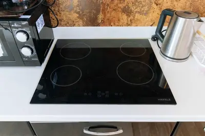 a stove top oven sitting on top of a counter at V259 Great for Relaxing with Pool & Full Amenities in Thalang