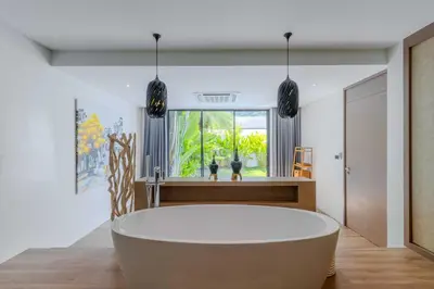 a large bath tub in a room with a window at V259 Great for Relaxing with Pool & Full Amenities in Thalang