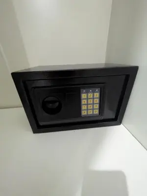 a safe in the corner of a room at Samakki Residence - Modern Rooms, Quiet Area, Near the Beach in Rawai Beach
