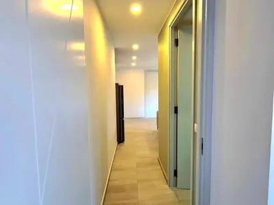 a hallway with a hallway leading into a room at Modern 61m² Apt - Central Chalong/ Fast WiFi in Ban Thalat Choeng Thale