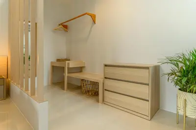 a room with a staircase with a shelf and a desk at Villa Mimosa 4 - Luxury 4BR Private Pool - Rawai in Kata Beach