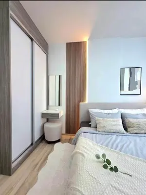 a bedroom with a bed and a sink in it at The Modern central Phuket base condo by luxStays in Ban Rangeng