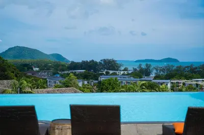 a view of a swimming pool from a resort at Cozy 1Bdr Apartment in La Vita Rawai Nai Harn in Rawai Beach