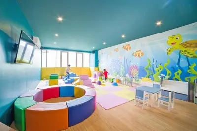 a room with a childrens room with a fish mural at Modern condo with full sea view, 4 min walk to Kamala beach in Kamala Beach