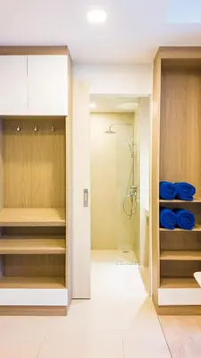 a bathroom with a shower and a walk in closet at Стильные апартаменты с террасой in Laguna Phuket