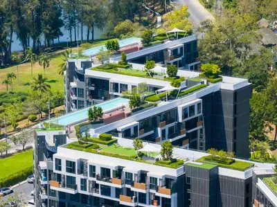 an overhead view of an apartment building with plants on its roofs at Стильные апартаменты с террасой in Laguna Phuket
