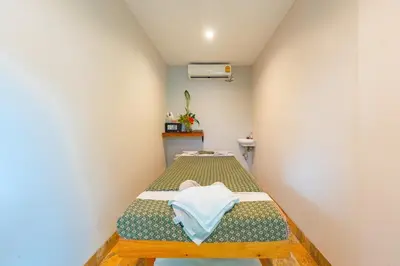 a small room with a bed in the corner at Kata Beach Tropical Hillside Retreat Jungle View in Kata Beach