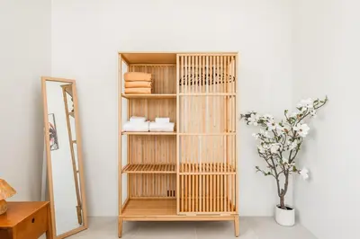 a bamboo shelf in a room with a mirror at Tropical Holiday Retreat 1BR Villa Near Bangtao in Ban Pak Lak