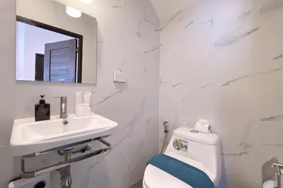 a white bathroom with a sink and a toilet at Goldena Twin Private Villas - Duplex Villa with Sauna, Kamala in Kamala Beach