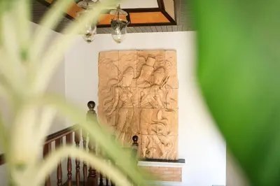 a large wooden relief on the wall of a building at Classic Cozy Thai Villa BIG pool Party OK in Patong Beach
