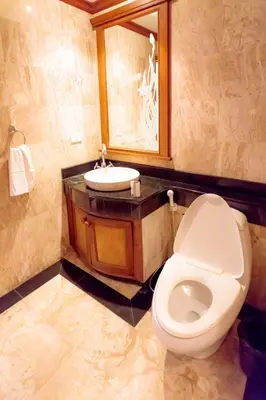 a bathroom with a toilet and a sink at Classic Cozy Thai Villa BIG pool Party OK in Patong Beach