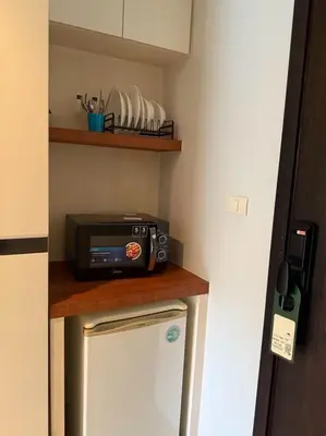 a microwave sitting on top of a kitchen counter at Studio apartment in Patong, Phuket in Patong Beach