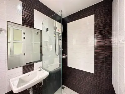 a bathroom with a sink and a glass shower at cozy Best house with garden near Bang Tao beach in Ban Thalat Choeng Thale